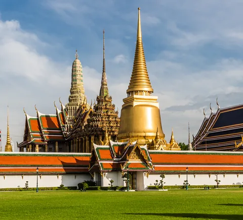 Wat Phra Kaew roofs and gilded pagodas within the Grand Palace precinct.