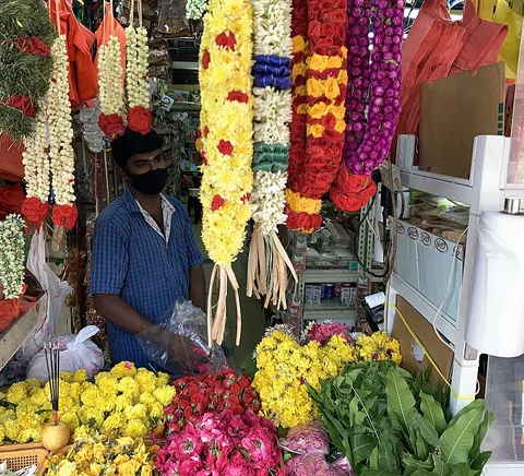 Flower seller and colourful garlands in Little India.