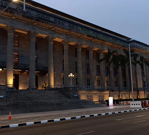 Former City Hall frontage of National Gallery Singapore at dusk.